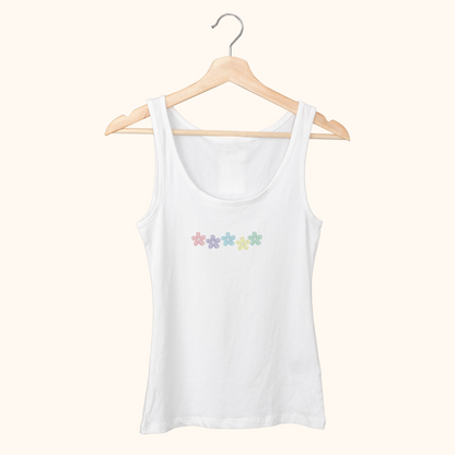 White tank top with colorful flower design on a wooden hanger against a white background