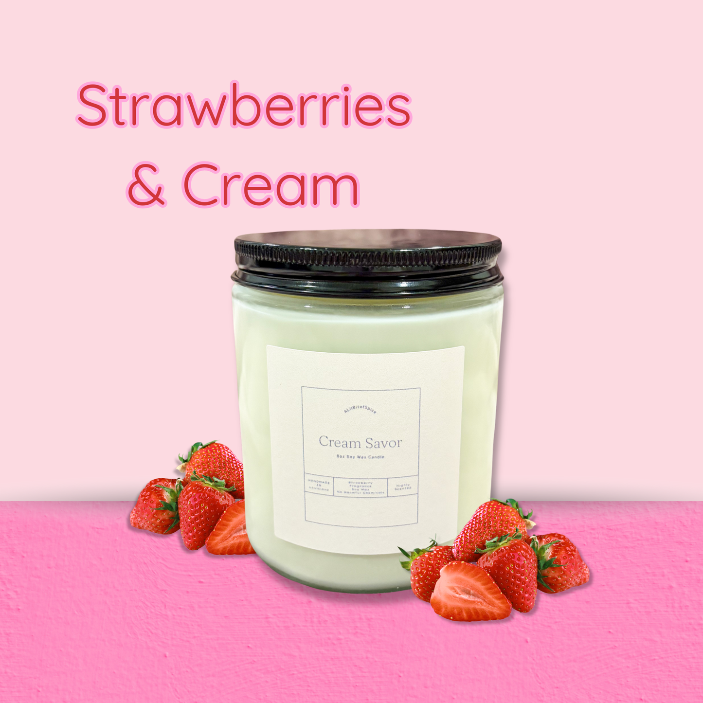 Candle labeled 'Strawberries & Cream' with strawberries on a pink background