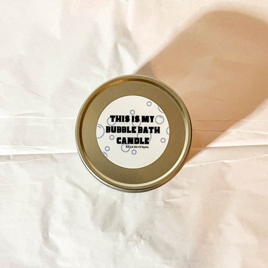 A silver candle tin labeled This is My Bubble Bath Candle against a white background with a shadow